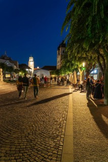 Night shot of the Peace Square in the old town centre of Trencín, in the background the Piarist