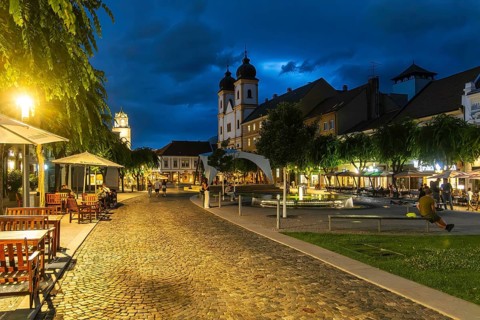 Night shot of the Peace Square in the old town centre of Trencín, in the background the Piarist