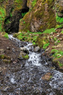 Entrance to the mystical lava cave, Sönghellir lava tube, Cave of Songs, watercourse, Arnarstapi,