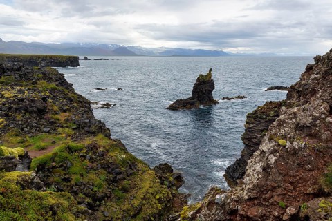 Bizarre rocky coast with rock needle, south coast, Arnarstapi, Faxafloi, Snæfellsnes peninsula,