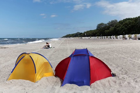 Two colourful beach shells, blue sky, Baltic Sea beach near Kühlungsborn, Mecklenburg-Western