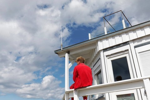 DLRG lifeguard at a rescue station, watching the beach, Kühlungsborn, Baltic Sea,