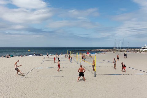 Beach volleyball players on volleyball courts on the beach, Kühlungsborn, Baltic Sea,