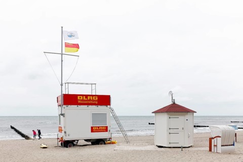 DLGR water rescue station on the beach at the Baltic Sea, grey sky, Kühlungsborn,