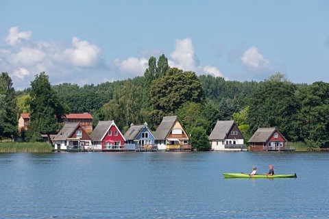Boathouses, holiday homes on Lake Mirow, canoe, Mirow, Mecklenburg Lake District,