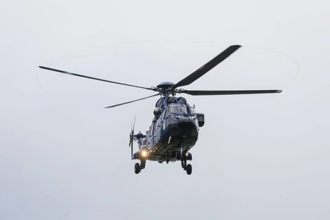 A helicopter with Emmanuel Macron (President of the French Republic) on board in front of a joint