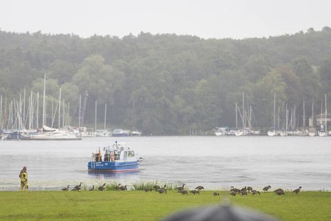 A water police boat guards the shore of Villa Borsig in front of a joint meeting between Friedrich