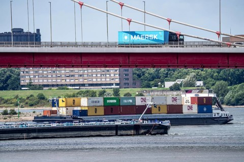 Barges on the Rhine at Ruhrort harbour, container freighter on uphill journey,