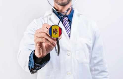 Moldova healthcare system, doctor holding stethoscope. Moldova health and medical insurance concept