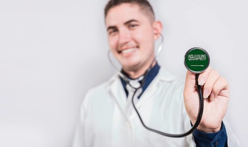 Doctor showing stethoscope with Saudi Arabia flag. Saudi Arabia national healthcare concept