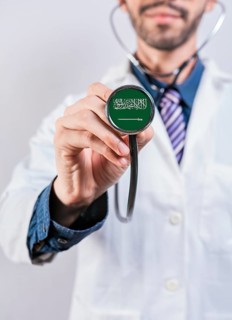 Saudi Arabia health and medical insurance concept. Saudi Arabia healthcare system, doctor holding