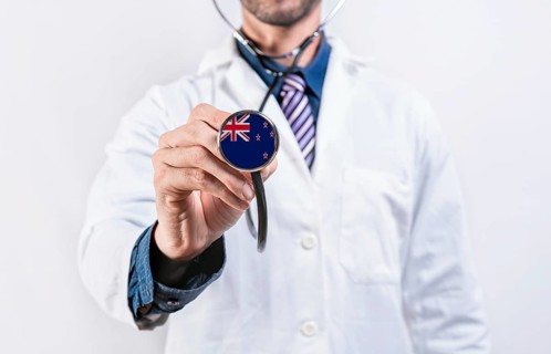 New Zealand healthcare system, doctor holding stethoscope. New Zealand health and medical insurance