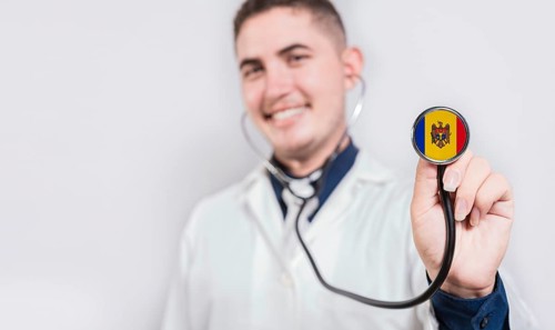 Doctor showing stethoscope with Moldova flag. Moldova national healthcare concept