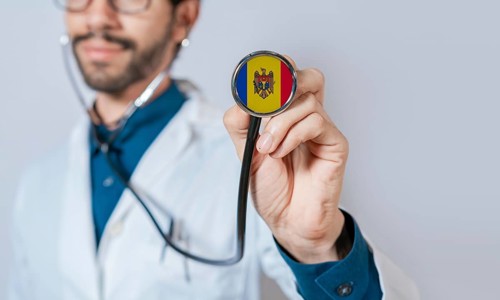 Doctor holding stethoscope with Moldova flag. Moldova health and care concept, Moldova flag on
