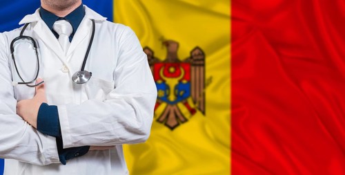 Male doctor with stethoscope on Moldova flag. Doctor holding stethoscope on Moldova flag