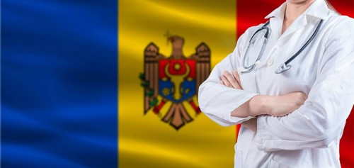 Doctor with crossed arms on Moldova flag. Moldova health and care concept. Female doctor on Moldova