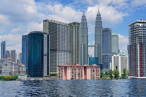 Kuala Lumpur city skyline seen from an infinity pool, Malaysia, Asia
