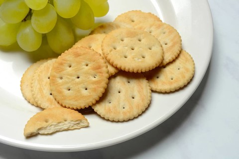 Crackers, crackers with grapes on a plate