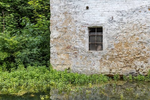 Old barn. The building is located near the source of the Zwiefalter Ach river at the Wimsen Cave