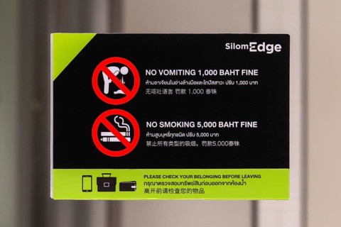 Sign fine for vomiting and smoking, Bangkok, Thailand