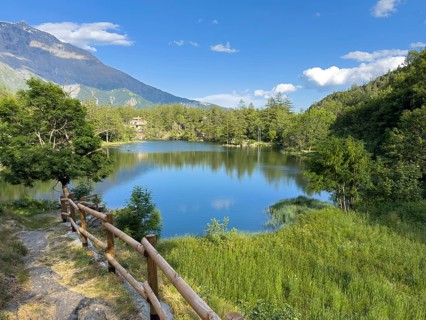 View of small picturesque romantic mountain lake Lago Grande near Moncenisio in Val Cenischia in