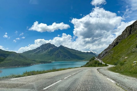Well developed pass road mountain road to pass summit of alpine pass Col du Mont Cenis, on the left