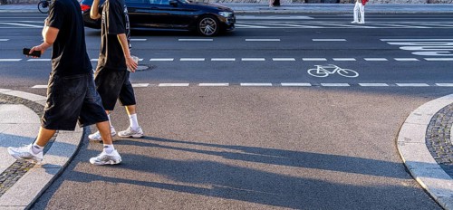 Road traffic and pedestrians on the carriageway in Berlin-Mitte, Unter den Linden, Berlin, Germany