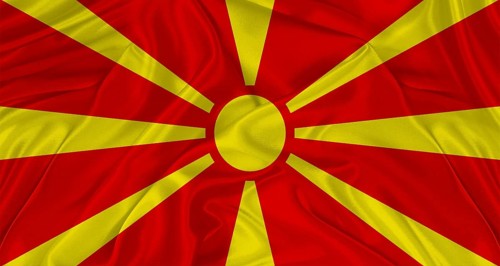 Flag of North Macedonia with cloth texture. Close up of Macedonian flag waving