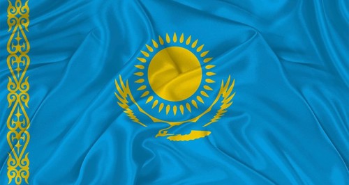 Flag of Kazakhstan with cloth texture. Close up of Kazakh flag waving