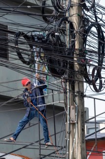 Craftsman welding metal rods, Bangkok, Thailand