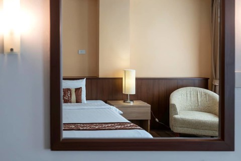 Symbol photo hotel room mirror bed