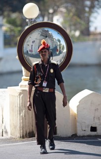 Security guard in traditional dress at the city palace, Udaipur, Rajasthan, India