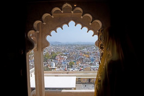 Indian woman with headscarf looking at the city, City Palace Museum, City Palace or City Palave,