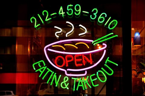 Illuminated advertising at a fast food restaurant, New York City, USA