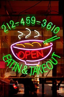Illuminated advertising at a fast food restaurant, New York City, USA