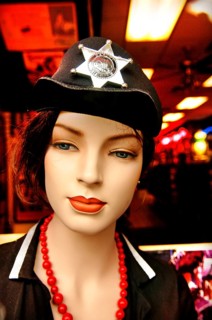 Female mannequin with sheriff's star on hat, New York City, USA
