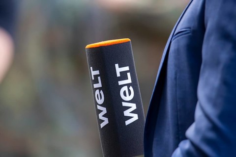 Close-up of a WELT microphone during a TV broadcast