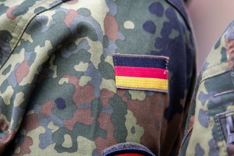 Bundeswehr symbolic image: close-up of the German flag on the Bundeswehr uniform