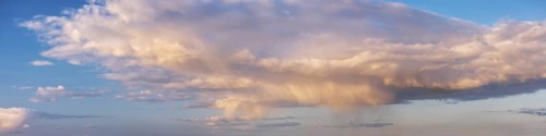Wallpaper for sky replacement, evening sky with illuminated clouds, soft pastel colours and rain