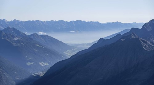 View of the Stubai Valley, mountain silhouettes, from the summit of the Wilder Freiger, Stubai