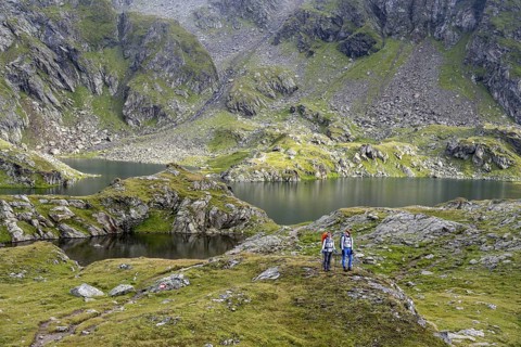 Two female mountaineers in a cloudy mountain landscape, Kreuzsee mountain lake, Wiener Höhenweg,