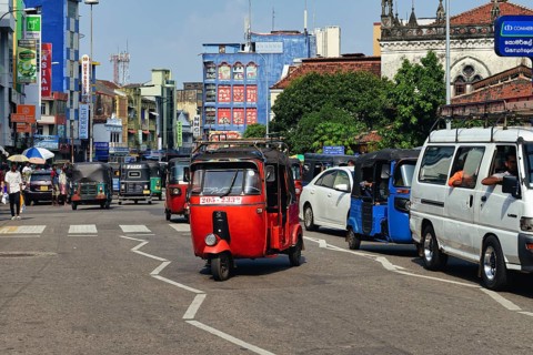 Motorized tuk tuk in a shopping street, Colombo, Sri Lanka