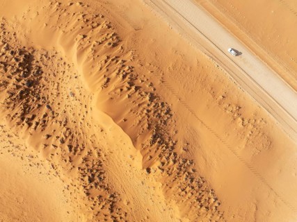 The C14 gravel road at the edge of the Namib Desert. Aerial view. Drone shot. Namibia