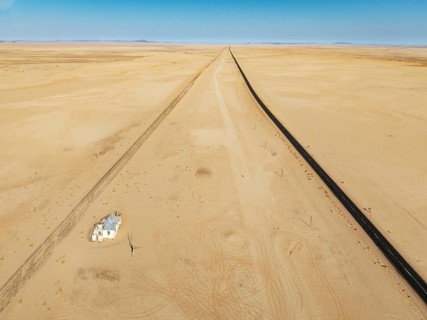 The long abandoned Garum train station and the B4 tarred road in the southern Namib Desert. Aerial