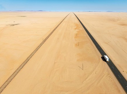 Rails and the B4 tarred road between Aus and Lüderitz in the southern Namib Desert. Aerial view.