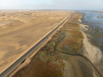 The Walvis Bay Lagoon between Namib Desert and Atlantic Ocean at low tide. Aerial view. Drone shot.