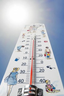 Worm's-eye view of thermometer measures extremely hot temperature of 38 degrees Celsius, 38 °C, 100