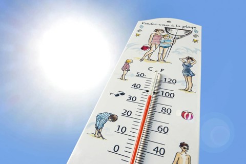 Worm's-eye view of thermometer measures extremely hot temperature of 36 degrees Celsius, 36 °C, 90