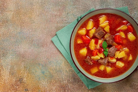 Meat goulash, with potatoes and carrots, sweet pepper, traditional Hungarian soup, homemade, no