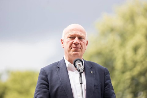 Kai Wegner (Governing Mayor of Berlin) gives a speech in front of the raising of the rainbow flag